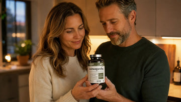 Adult man and woman jointly holding an Elexir Ashwagandha bottle