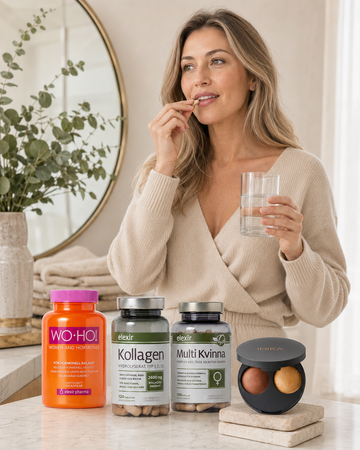European woman taking an iWell wellness supplement with water
